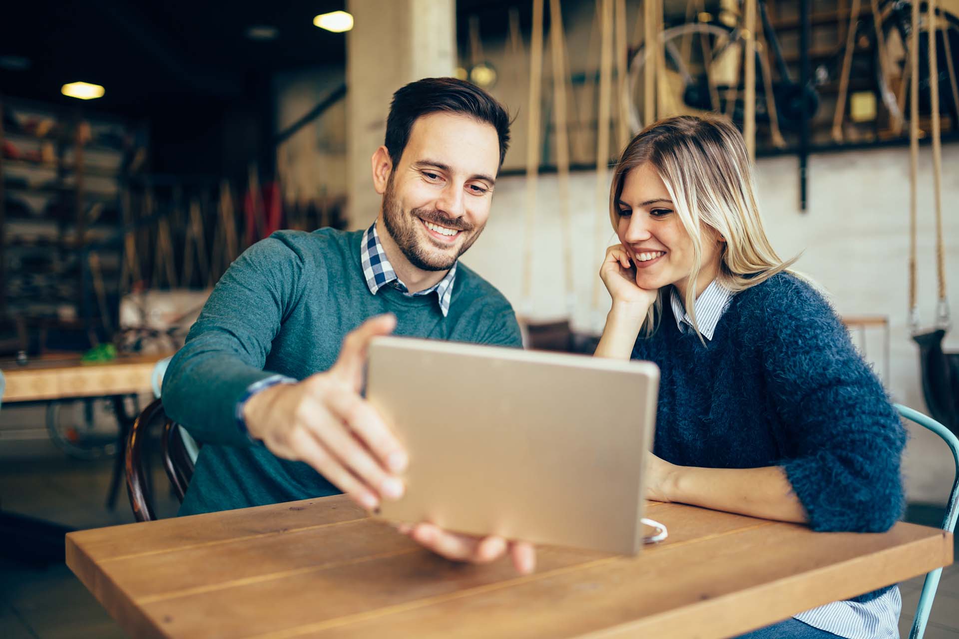 Couple using tablet in the restaurant.