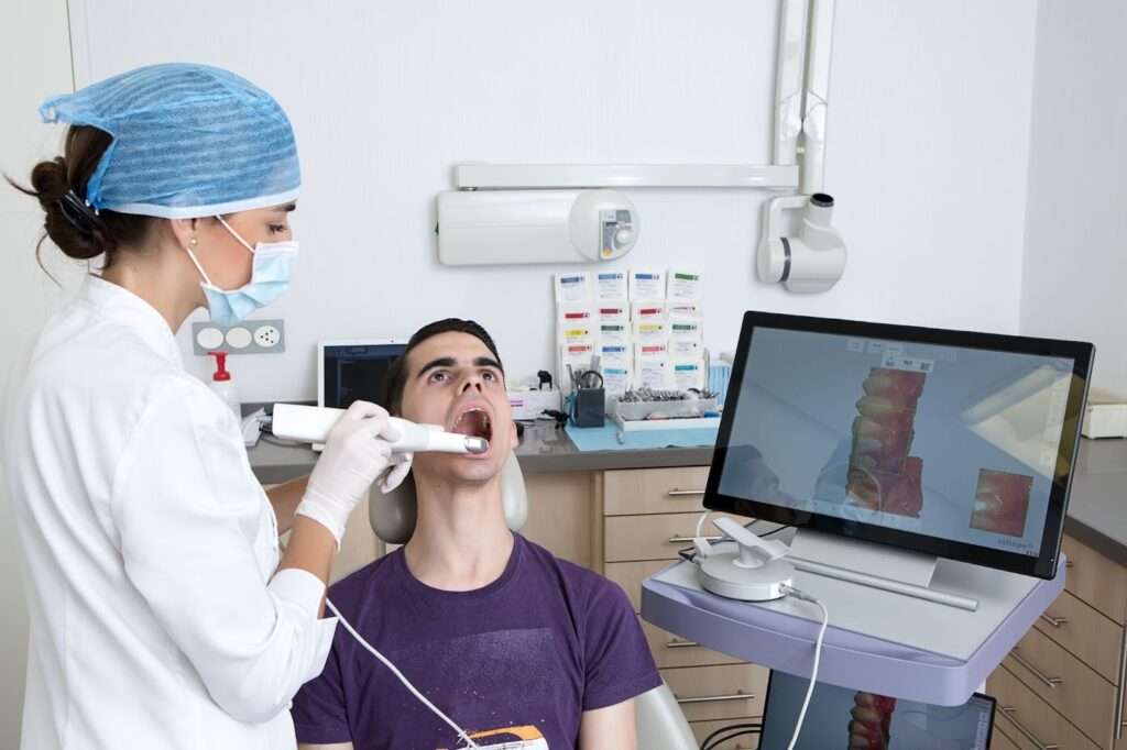 Dentist conducting dental examination with patient.